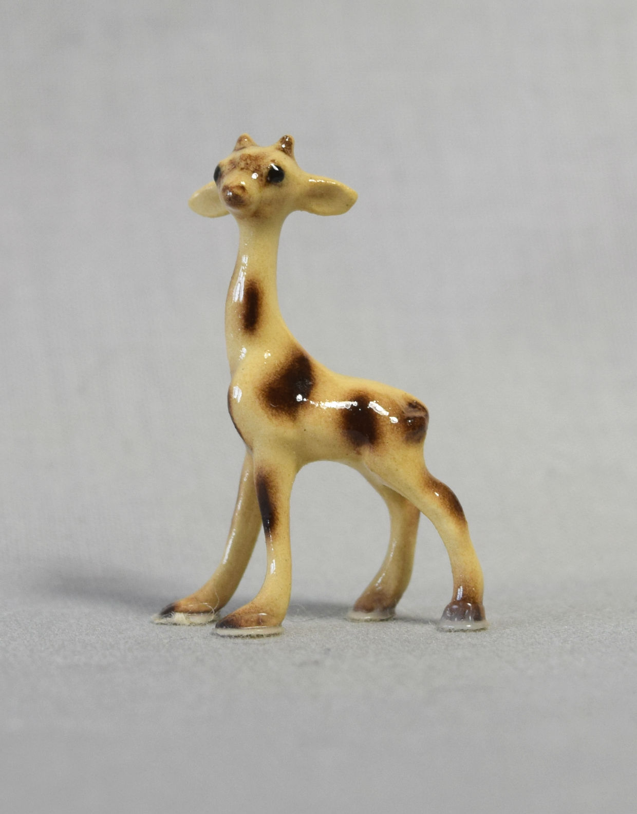 Giraffe baby, facing left-image