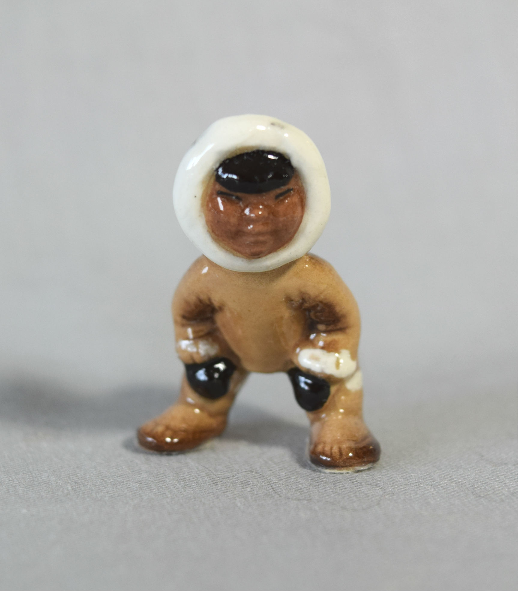 Eskimo Tot, crouched-image